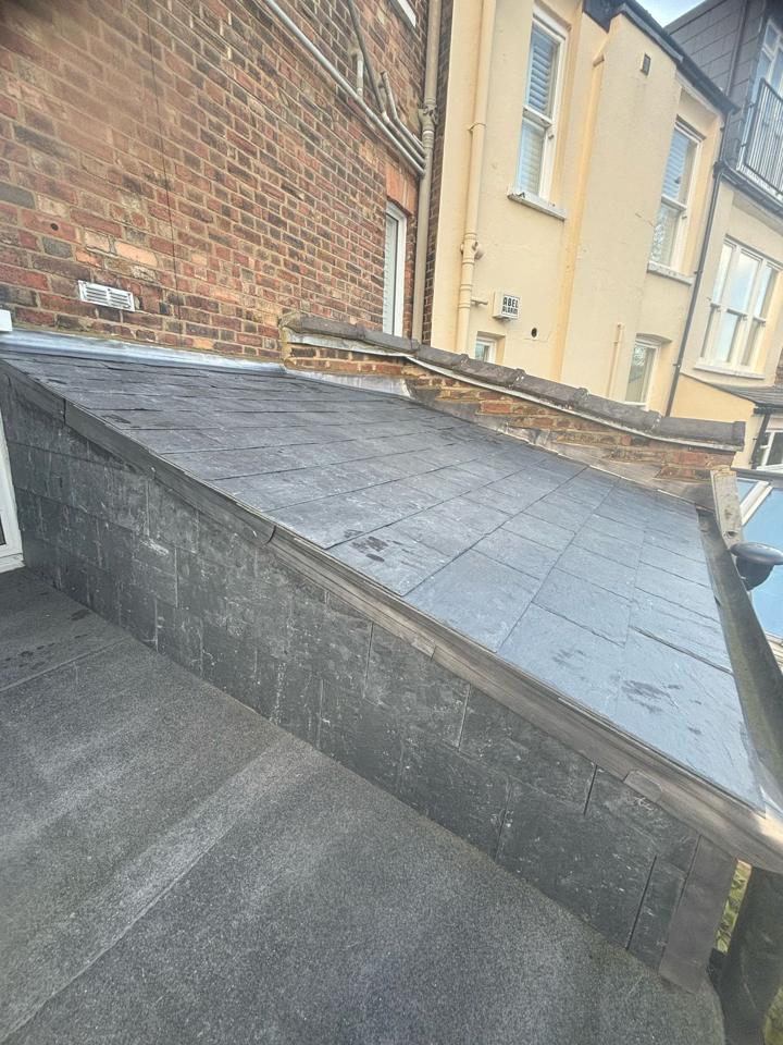 Freshly re-slated roof with even new slates and flashings